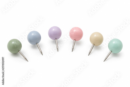 Pastel Round Push Pins Arranged on White Background