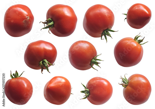 Photography Set of ripe red whole tomatoes with green stems shot in natural light, isolated