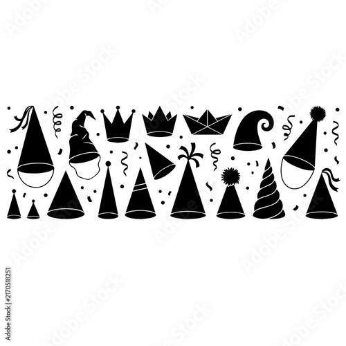 Assorted black party hats, crowns, and paper boats with confetti and streamers isolated on a white background, for celebration themes