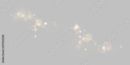 Fotografie Curved trail of soft glowing gold bokeh lights and starbursts on a black backgro