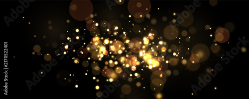 Cluster of glowing golden bokeh lights scattered on a black background with varied intensity and sizes on transparent background