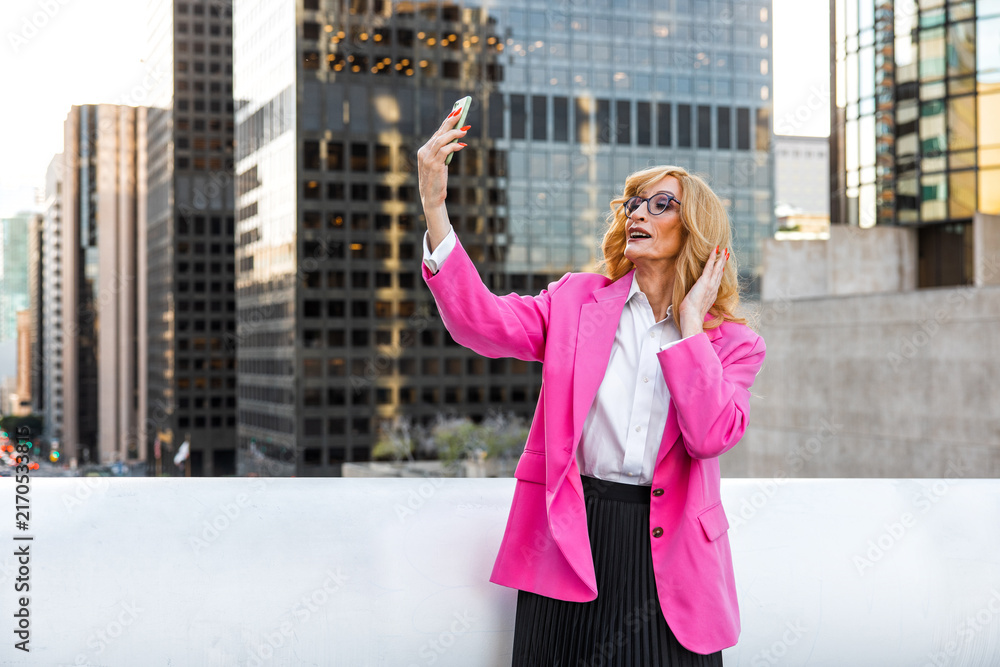 Fototapeta premium Transgender business woman lifestyle moments in downtown, Los angeles.