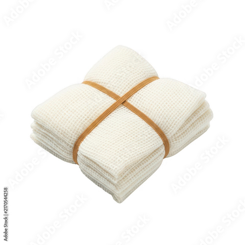 Stack of folded soft white cotton washcloths tied with a simple brown string ribbon isolated on transparent background