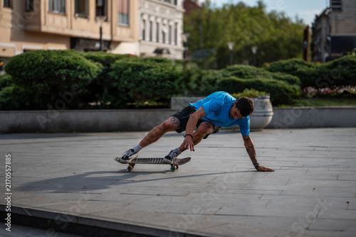 Konstfotografi Skateboarder balancing on board performing urban trick