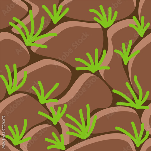 Seamless pattern with a stone wall and green grass background