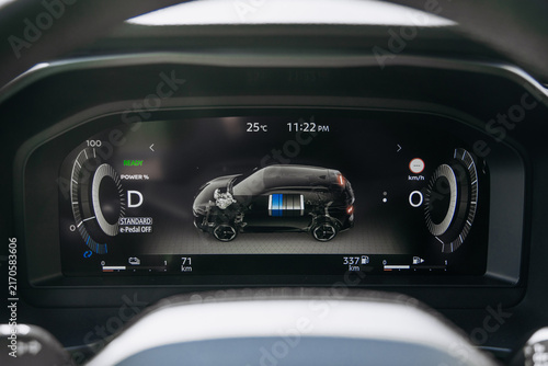 Принти на полотні High-tech car interior featuring a digital speedometer and multifunction steering wheel