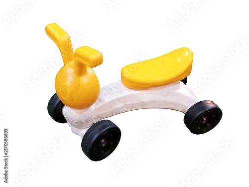 Yellow and white plastic balance bike toy for toddlers learning to ride and developing motor skills