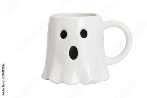 Fotografie White ceramic ghost-shaped mug with black eyes and an open mouth, isolated on a