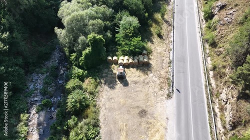 Classic Soviet Russian Tractor Parked with Round Hay Bales Aerial Shot