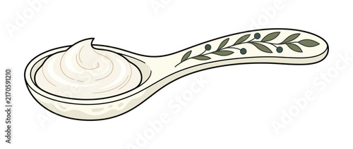 Creamy substance on decorative spoon, isolated on white