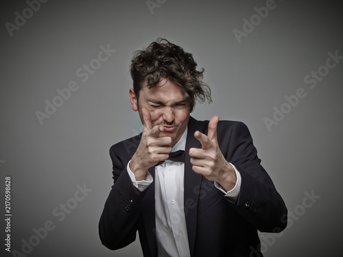 Portrait of man 'shooting' viewer