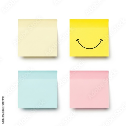 Four colorful sticky notes with smiley face isolated on white background