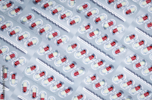 Принти на полотні Red and white capsule medicine sealed in blister packs, pharmaceutical packaging