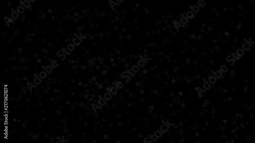 Dark abstract background with scattered small glowing circles and bubbles pattern.