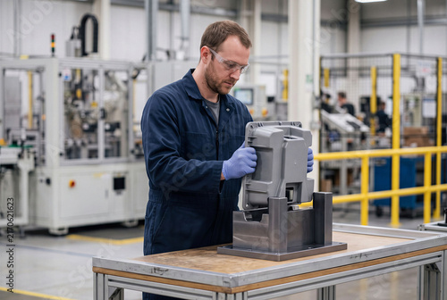 Quality Inspector Checking Molded Part Fit on Production Line