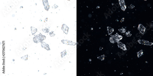 Floating crystal shards on split black and white background depicting purity and contrast concept