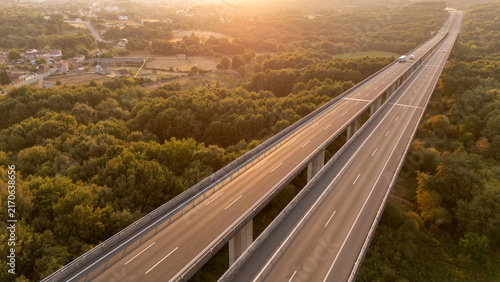 Allariz highway viaduct crossing forest at sunset