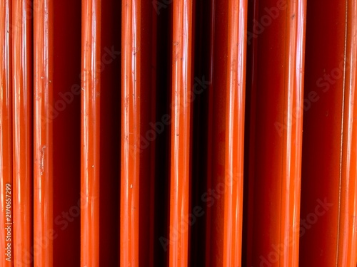 bright orange corrugated metal folding door texture background