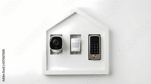 Smart Home Security Devices Mounted on a House Shaped Display