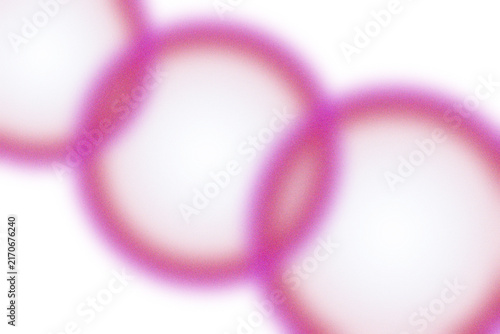 Abstract pink light flare circles glowing with a soft focus effect