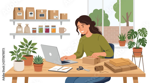 A smiling woman works on her laptop while packing small business orders at a plant-filled wooden desk in her cozy shop.