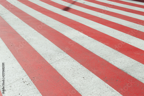 Red-and-white markings on the road for fire equipment. Indicates the place where you cannot park a car.