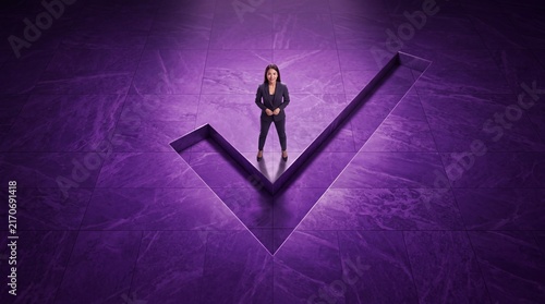 Businesswoman Standing on Giant Checkmark Symbol