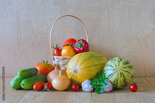 Fresh Assorted Vegetables and Melons on Rustic Wooden Table