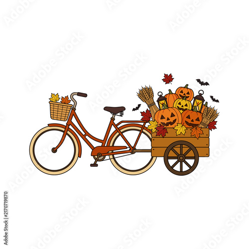 Bicycle with a wagon full of pumpkins and autumn leaves