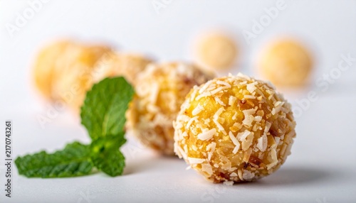 Banana Coconut Cake Balls. Small, moist banana cake balls coated in shredded coconut. Delicious tropical bite-sized snacks, perfect for parties.
