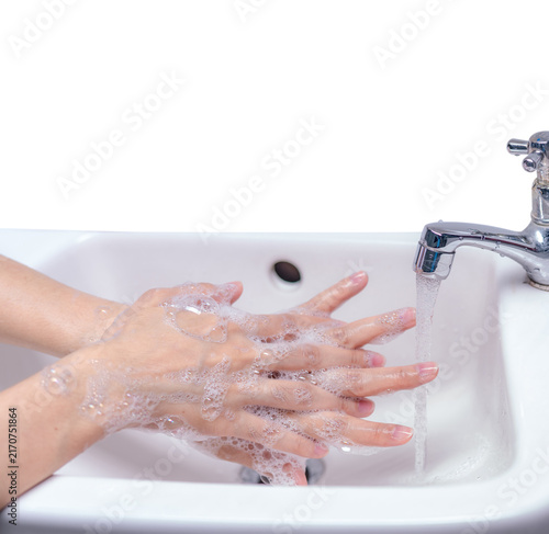Quadro su tela Woman washing hand with soap foam and tap water in bathroom