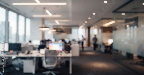 Fully blurred modern office background with soft daylight, abstract workspaces, subtle reflections, and professional bokeh, ideal for corporate branding, technology marketing, and presentations