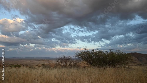 Clouds drift over the Namibian desert, African landscape. Timelapse.