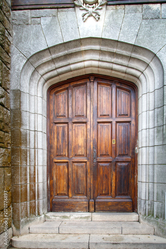 old wooden door in a stone wall
