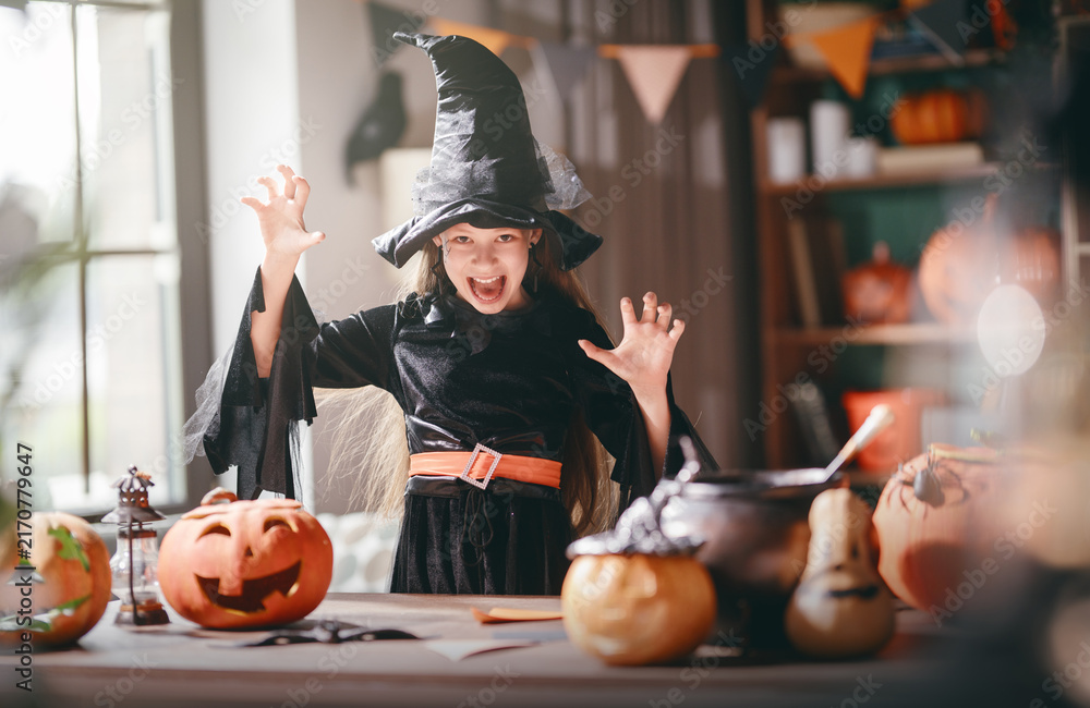 Naklejka premium Joyful Girl in Witch Costume Celebrating Halloween