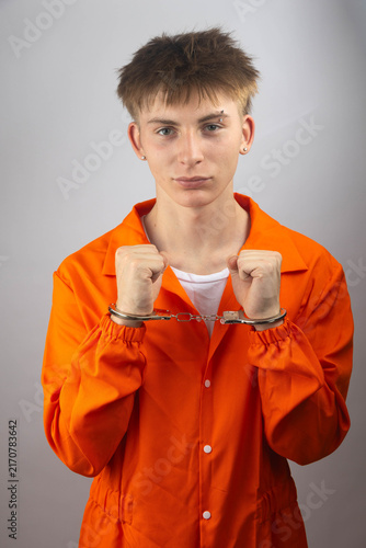 Fotografie Teenage Prisoner in Orange Jumpsuit