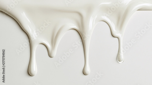 Glossy white ice cream drips on a light surface. Close-up texture for food, dairy, cosmetics, or design visuals.
