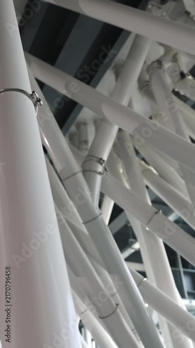 Vertical video. A modern mill complex for grain processing and flour production. Grain is supplied through pipes to the mill. Mill plant. Production of flour for baking.
