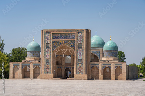 Cityscape view of Barakhan or Barak Khan madrasa facade and blue domes on Khast Imam square, religious center of Tashkent, Uzbekistan