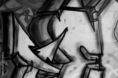 Black and white urban graffiti texture distressed wall fragments, spray paint details, scratches and grunge street art elements. Monochrome abstract background inspired by underground city culture