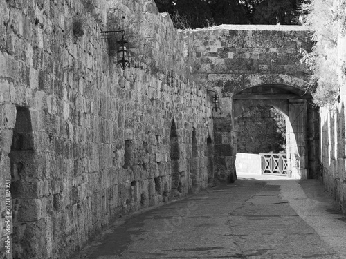 фотографія Historic stone fortress with a massive defensive wall, small embrasures, and a r