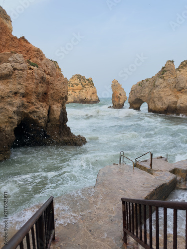 Rocky coastal cliffs and natural arch at Ponta da Piedade