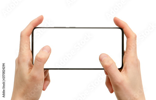 Hands holding horizontal smartphone with thumbs playing video game mockup isolated on white