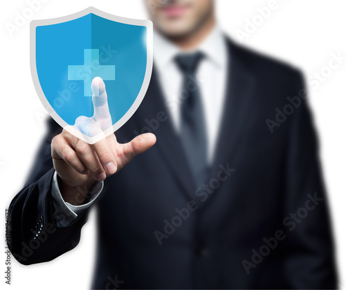Businessman in a dark suit interacting with a digital security shield interface, symbolizing cybersecurity, data protection, privacy, secure access, online security, network protection, and modern bus