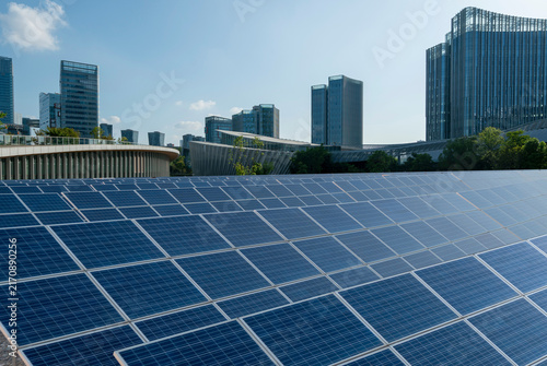Photovoltaic power plants and modern urban skylines