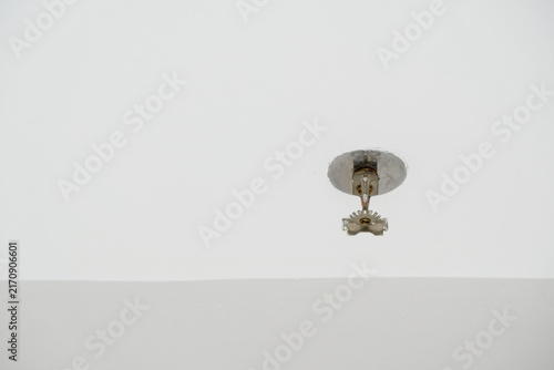 Konstfotografi Fire sprinkle head mounted on a clean white ceiling