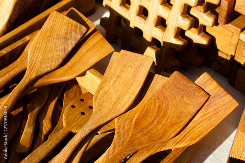 Wooden spatulas and kitchen utensils made from natural wood. Wooden cooking utensils and kitchen items.