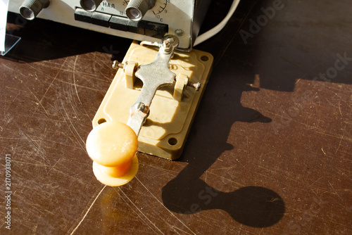A machine for sending and receiving Morse code. A vertical telegraph key for transmitting radio messages.