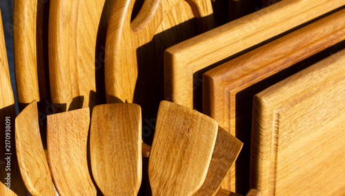 Wooden spatulas and kitchen utensils made from natural wood. Wooden cooking utensils and kitchen items.