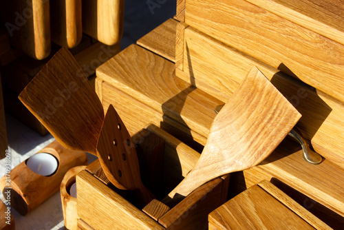 Wooden spatulas and kitchen utensils made from natural wood. Wooden cooking utensils and kitchen items.